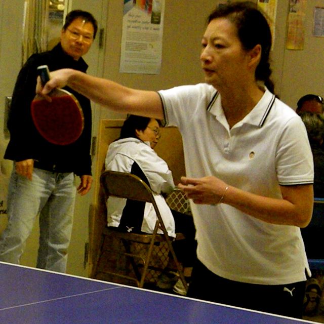 Woman playing ping pong