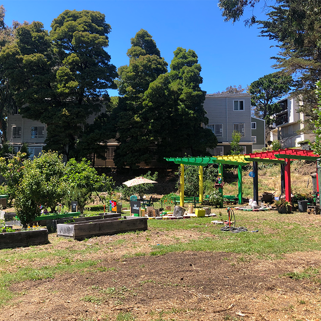 Colorful pergolas and garden boxes at Adam Rogers Community Garden 1