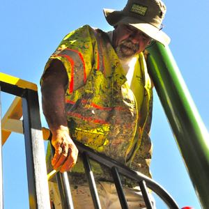 Parks and Recreation employee getting dirty on the job