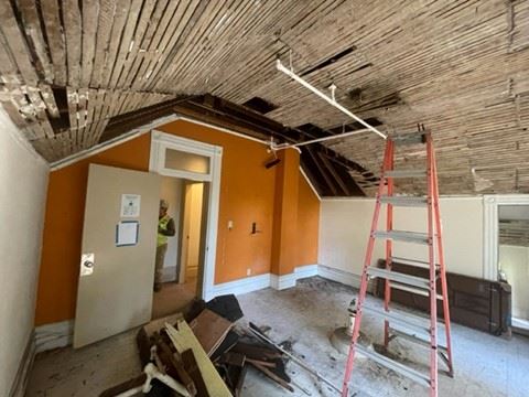 Ceiling damage shown from inside the clubhouse
