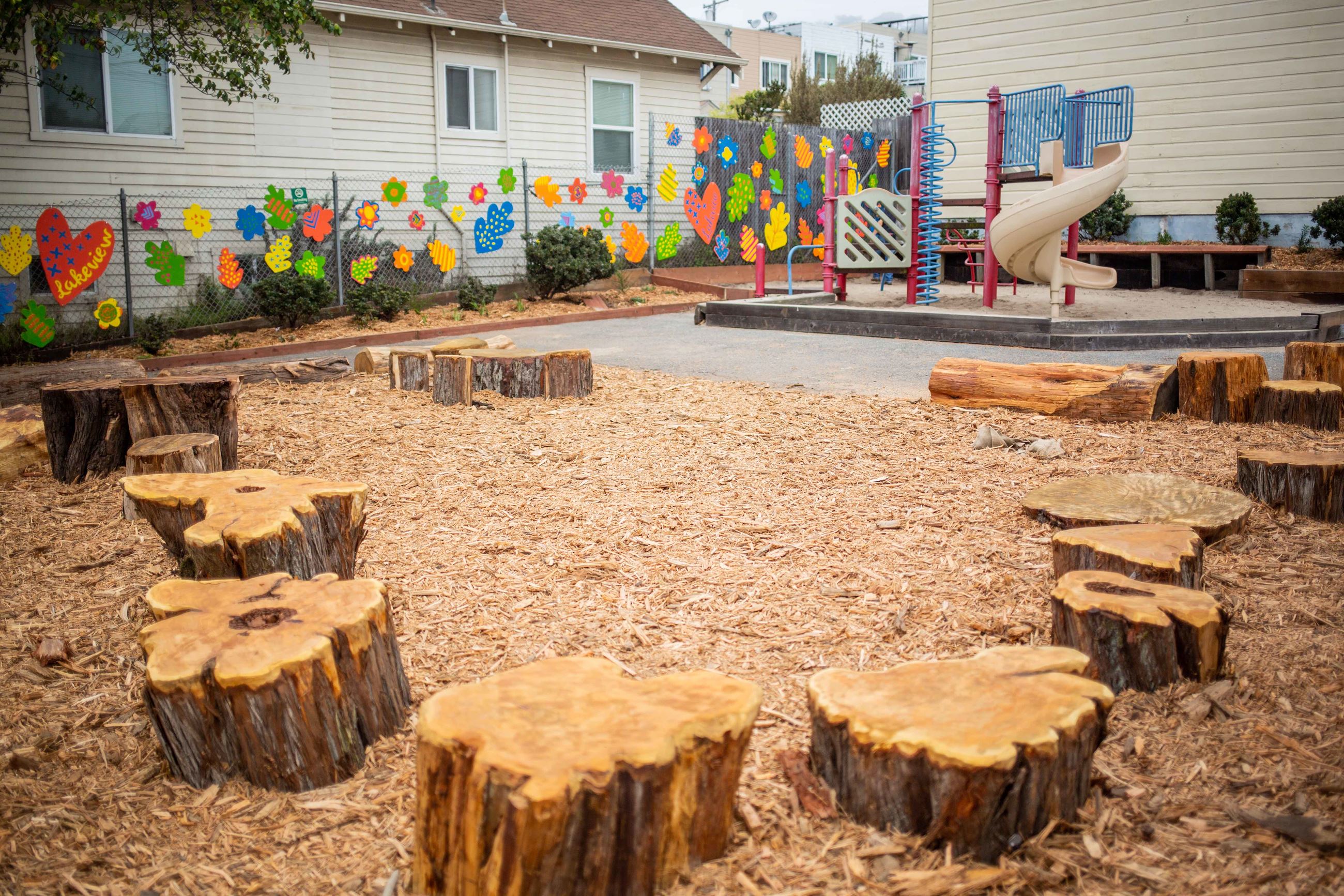 Circle of logs on wood chips.