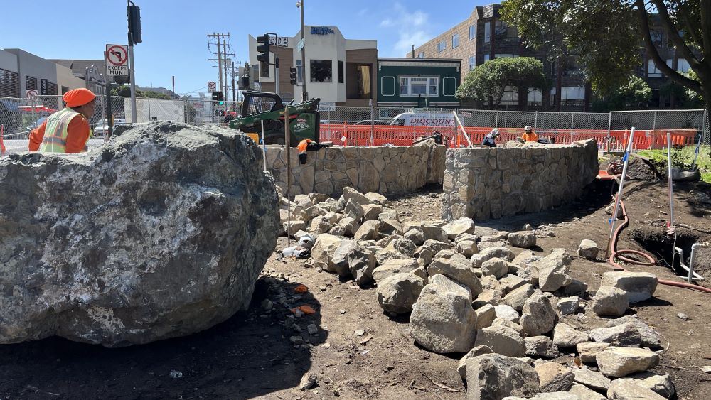 Rock walls being cut and installed