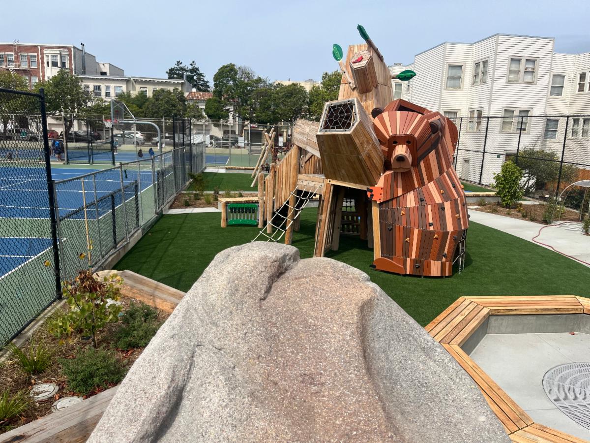 Bear play structure and boulder play structure at playground reopening August 2024